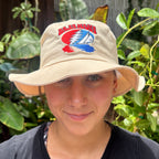 Tan Baja Haha bucket hat on model.