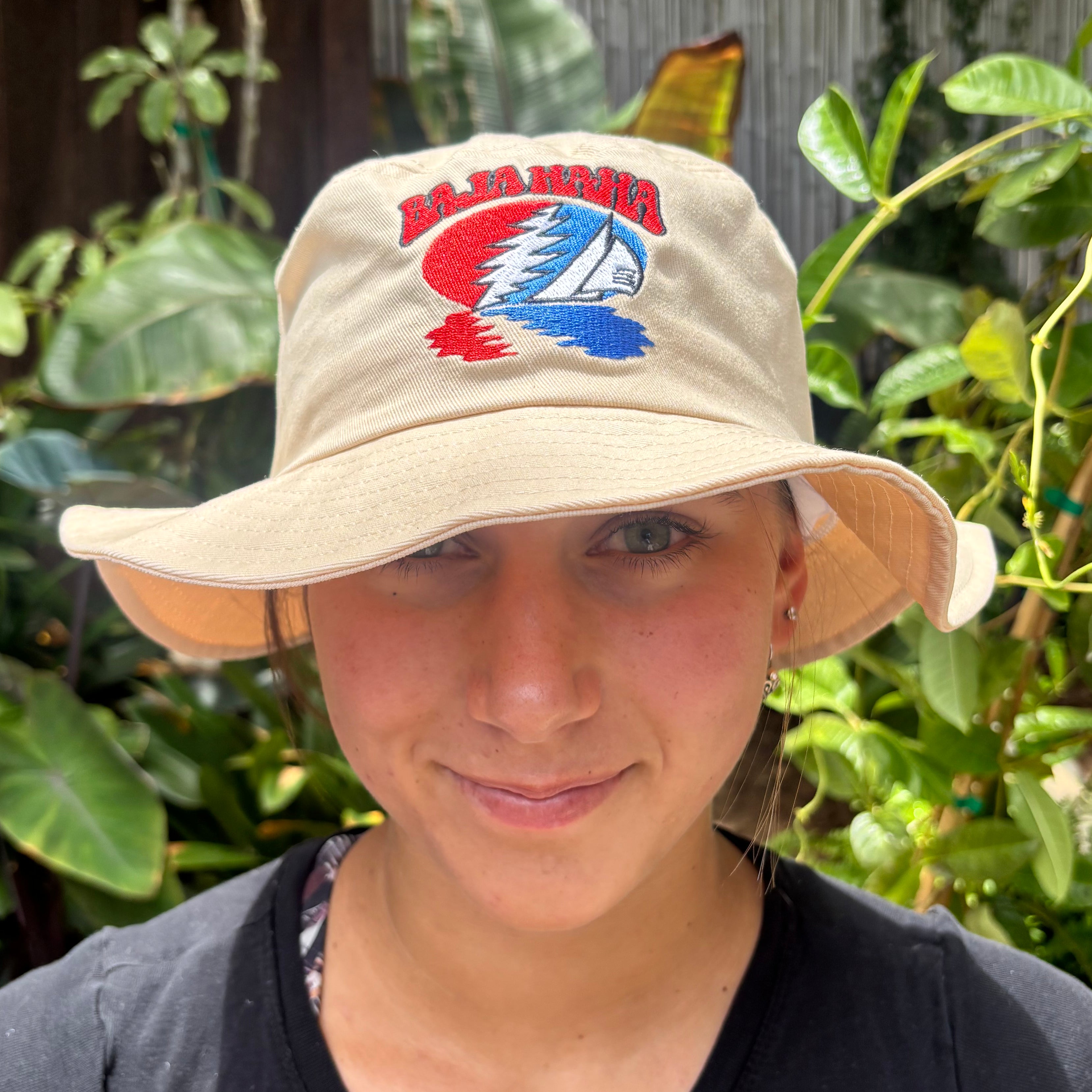 Tan Baja Haha bucket hat on model.