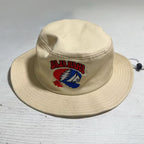 Tan Balahaha bucket hat on table.