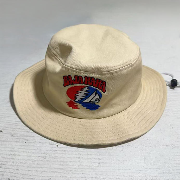 Tan Balahaha bucket hat on table.