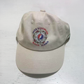 Tan hat with the Dead Reckoning, Baja Haha logo of a compass with a skull and roses.