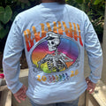 The back of a grey shirt with a skeleton captain and the words Bajahaha 2026. There is a sunset background to the skeleton.