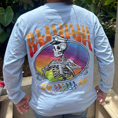 The back of a grey shirt with a skeleton captain and the words Bajahaha 2026. There is a sunset background to the skeleton.